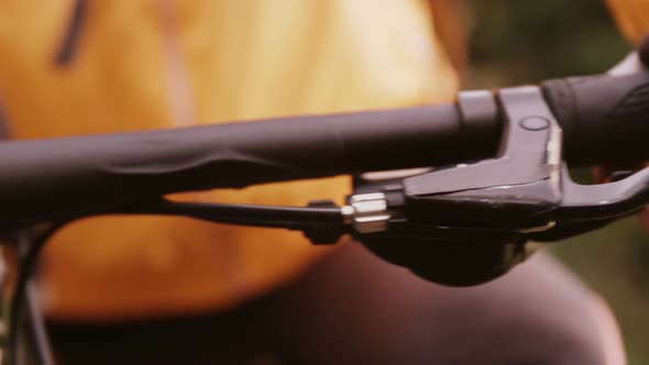 Close-up of mountain biker pressing brake