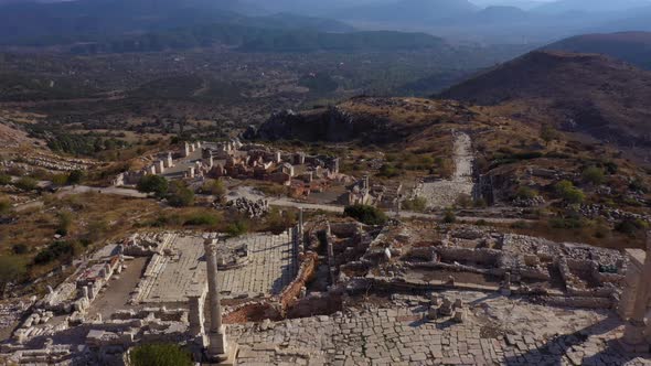 Aerial View of City Ruins with Mountains in the Background