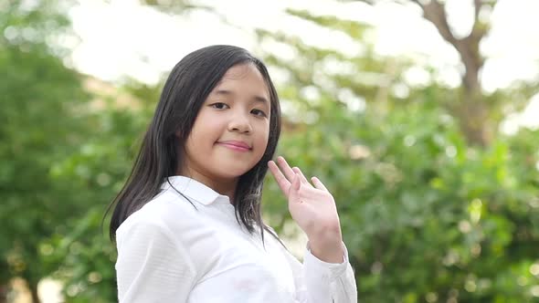 Slow Motion Of Asian Girl In Student Uniform Going To School And Waving Goodbye