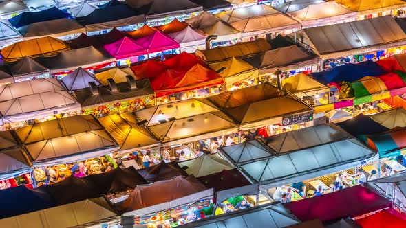 time lapse of Train Night Market Ratchada (Talad Rot Fai) at night in Bangkok, Thailand