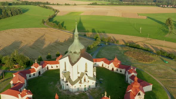 Flying Above the Pilgrimage Church of Saint John of Nepomuk on the Green Hill at Sunset