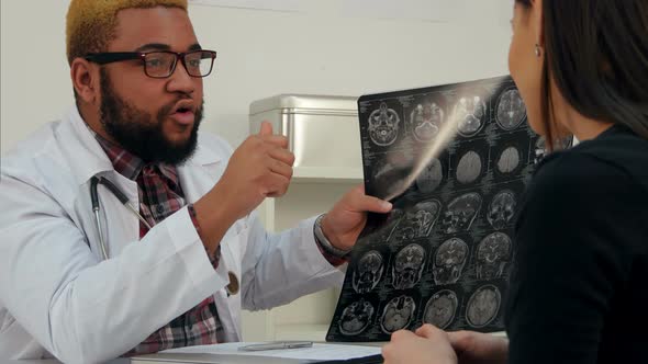 Happy Female Patient Thanking Her Doctor and Taking Xray Image with Her