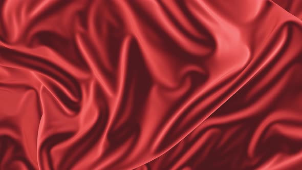 The red silk fabric moves slowly in the wind.