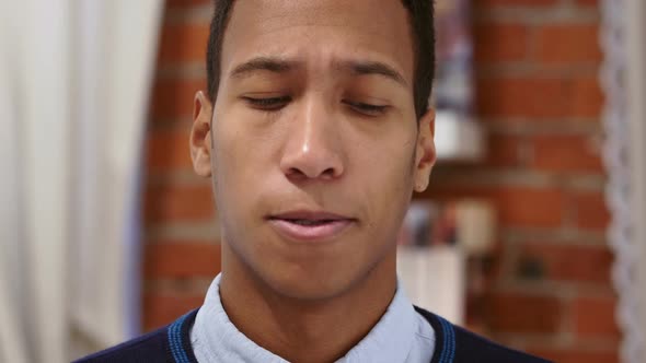 Sad Young African Man Feeling Upset and Lost Loft Background