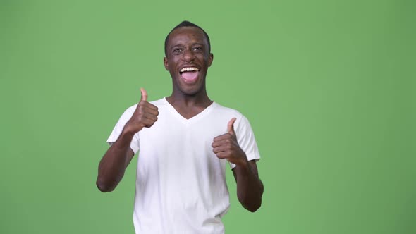 Young Happy African Man Smiling While Giving Thumbs Up