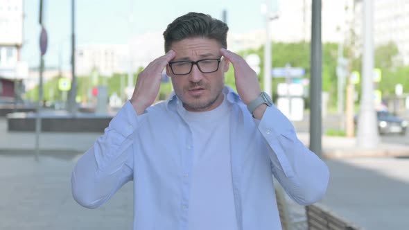 Portrait of Man Having Headache Outdoor