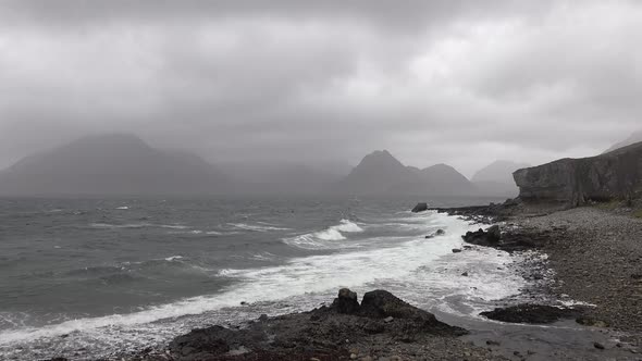 Elgol Beach at Port Na Cullaidh with Red Cuillin Mountains Under Clouds on Loch Scavaig Scottish