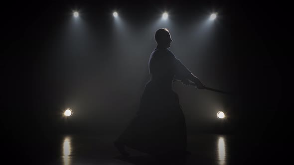 Kendo Master Practicing Martial Art with the Katana Sword