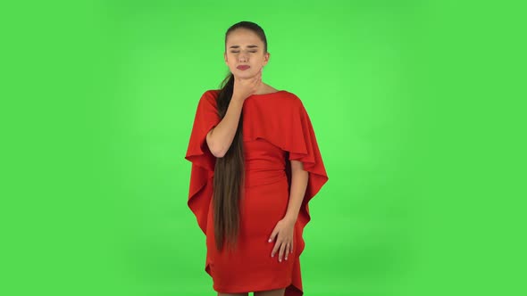 Pretty Young Woman Is Getting a Cold, Sore Throat and Head, Cough. Green Screen