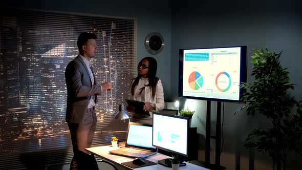 Multiracial Specialists in Economics Analyzing World's Market Development Described on Infographic