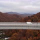 Aerial View of the Highway Viaduct on Concrete Pillars in the Mountains, Drone Flight Along the - VideoHive Item for Sale