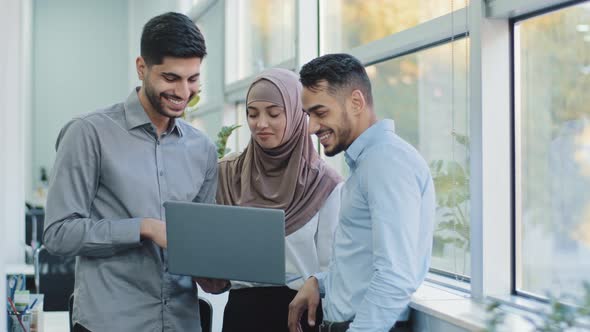 Multiethnic Colleagues Listens Arabic Team Leader Explain Corporate Task Application to Diverse
