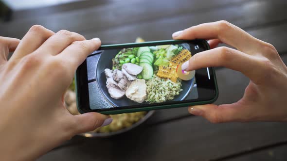 Female Hands Make Video of Lunch Bowl By Phone in Cafe