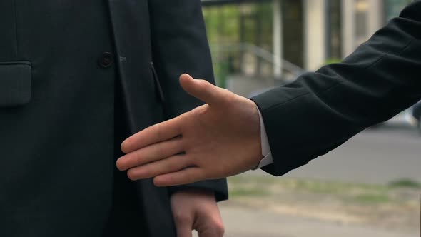 Handshake of Two Businesspeople Standing Near Office, Agreement, Partnership