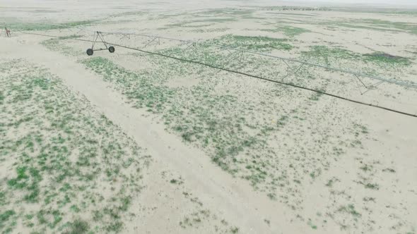  Flying over Dunes over  farming in the Desert   and showing Irrigation System for farming 