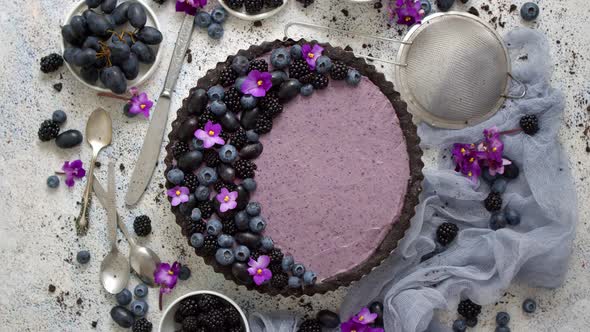 Homemade Blackberry Tart. Sweet Pie with Blackberrym Blueberry and Grapes on Stone Table