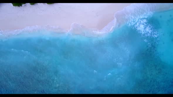 Aerial flying over seascape of marine coastline beach time by shallow sea and white sand background 