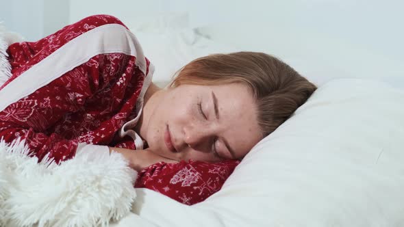 A Calm Young Girl Sleeps Soundly in a Comfortable Cozy Fresh Bed on a Soft Pillow Enjoying a Healthy