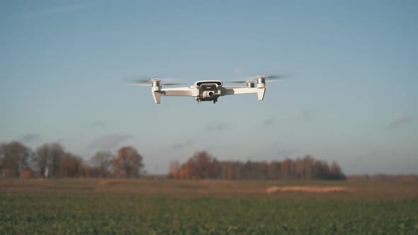 White Drone Hanging in Air or Flying on Nature Background 4K Shot	