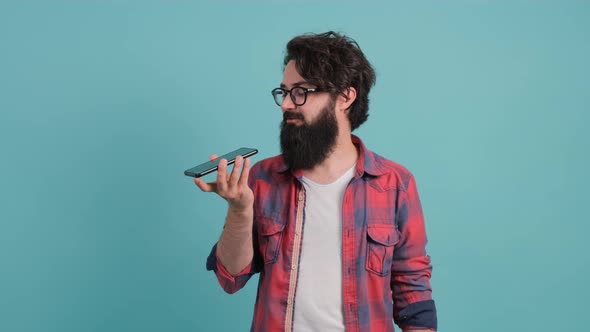 Close Up of a Young Man That Is Recording a Vocal Message