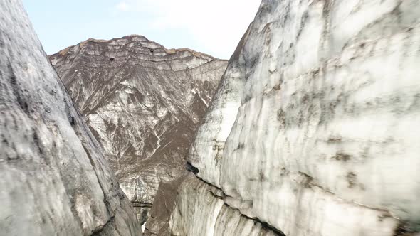 Flying Through Towering Rock Mountains In Katla Ice Cave At Myrdalsjokull Glacier In South Iceland.