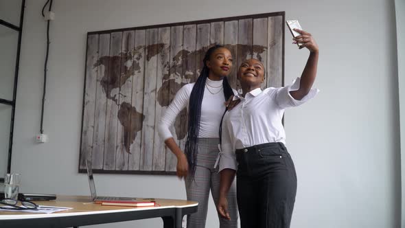 Two Happy African American Business Partners Makes Selfie