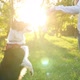 Beautiful Brunette Playing with Dog in Nature During Sunset - VideoHive Item for Sale