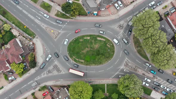 Stationary overhead aerial shot of a busy roundabout