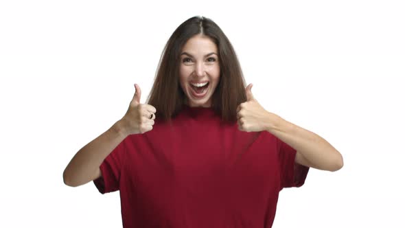 Attractive Brunette Girl in Red Tshirt Jumping From Bottom Showing Thumbsup and Rejoicing