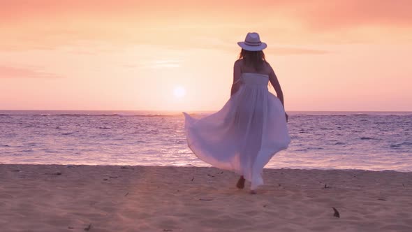 Silhouette of Happy Bride Woman Running By Sandy Beach Cinematic Pink Sunset