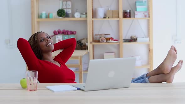 Woman with Resting Her Legs on the Table at Home Office Look at Camera Portrait Spbi