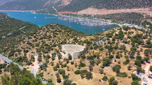 Aerial Drone circling the Hellenistic Theatre on a hill along the peninsula of Kas Turkey near north