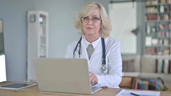 Senior Old Female Doctor Saying No By Finger Sign