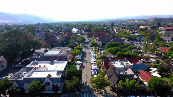 Fly over drone shot of the farmers market that is ever Wednesday in Solvang California.