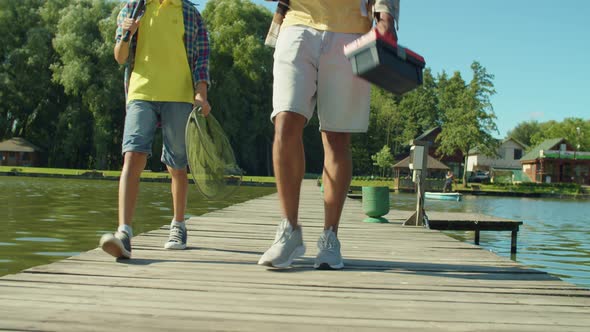 Multiracial Family with Fishing Rods and Equipment Going for Fishing on Pond