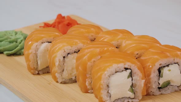 Japanese Sushi Rolls Close-up Is Moving. Variety of Types Sushi with Philadelphia. Wasabi, Ginger