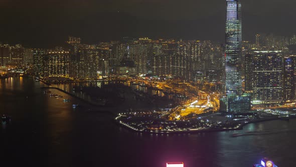 Hong Kong Urban Cityscape Aerial Skyline Panorama Timelapse at Night Pan Up