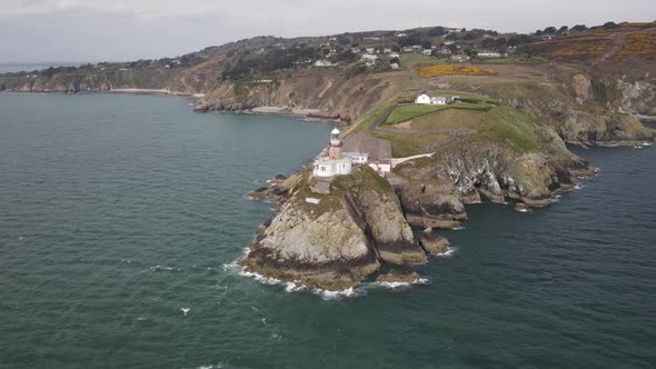 Baily Lighthouse At Howth Head, Dublin Bay Ireland - aerial drone shot
