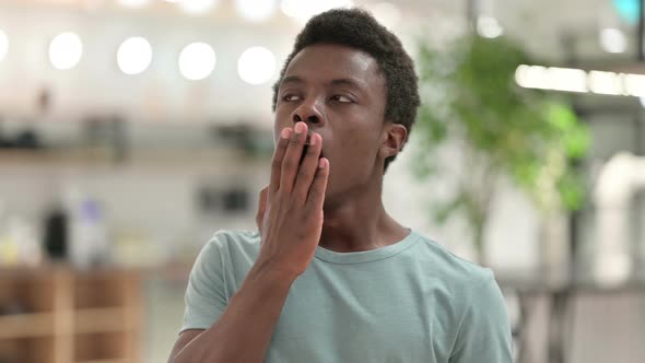 Yawning Young African Man