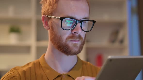 Close Up of Redhead Man Using Digital Tablet with Chroma Screen