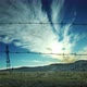 4K Motion time lapse from behind the wire mesh. Moving white clouds. - VideoHive Item for Sale