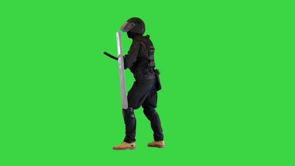 Riot Police Unit Making Sound Hitting Shield with Baton on a Green Screen Chroma Key