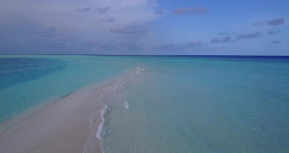 Daytime aerial abstract view of a summer white paradise sand beach and blue water background in best