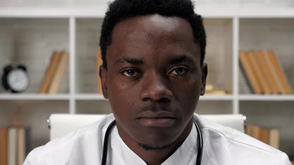 Close Up Face African American Man Doctor Looking Camera in Hospital Office