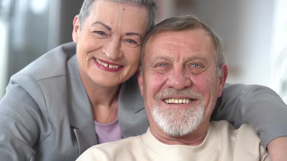 Woman and Man Lean Their Foreheads Against Each Other Portrait of an Elderly Family