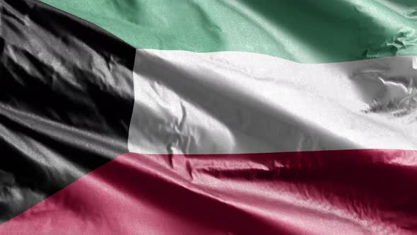 Kuwait textile flag waving on the wind. Slow motion. 20 seconds loop.