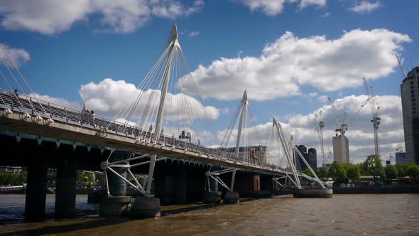 Moving Under Footbridge Over City River