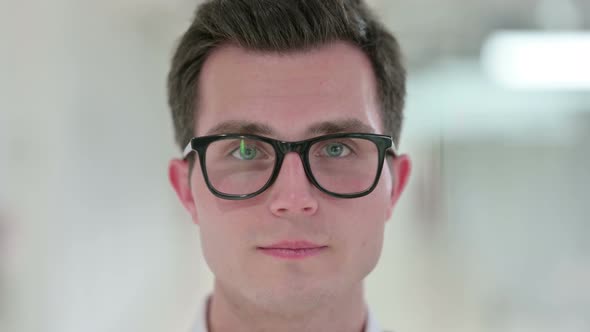 Close Up of Face of Serious Young Man 