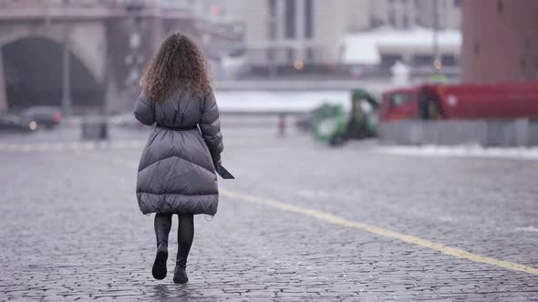 Young Lady is Strolling in City at Snowless Winter Day Happy Townswoman