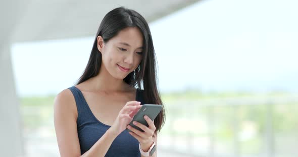 Woman working on mobile phone 